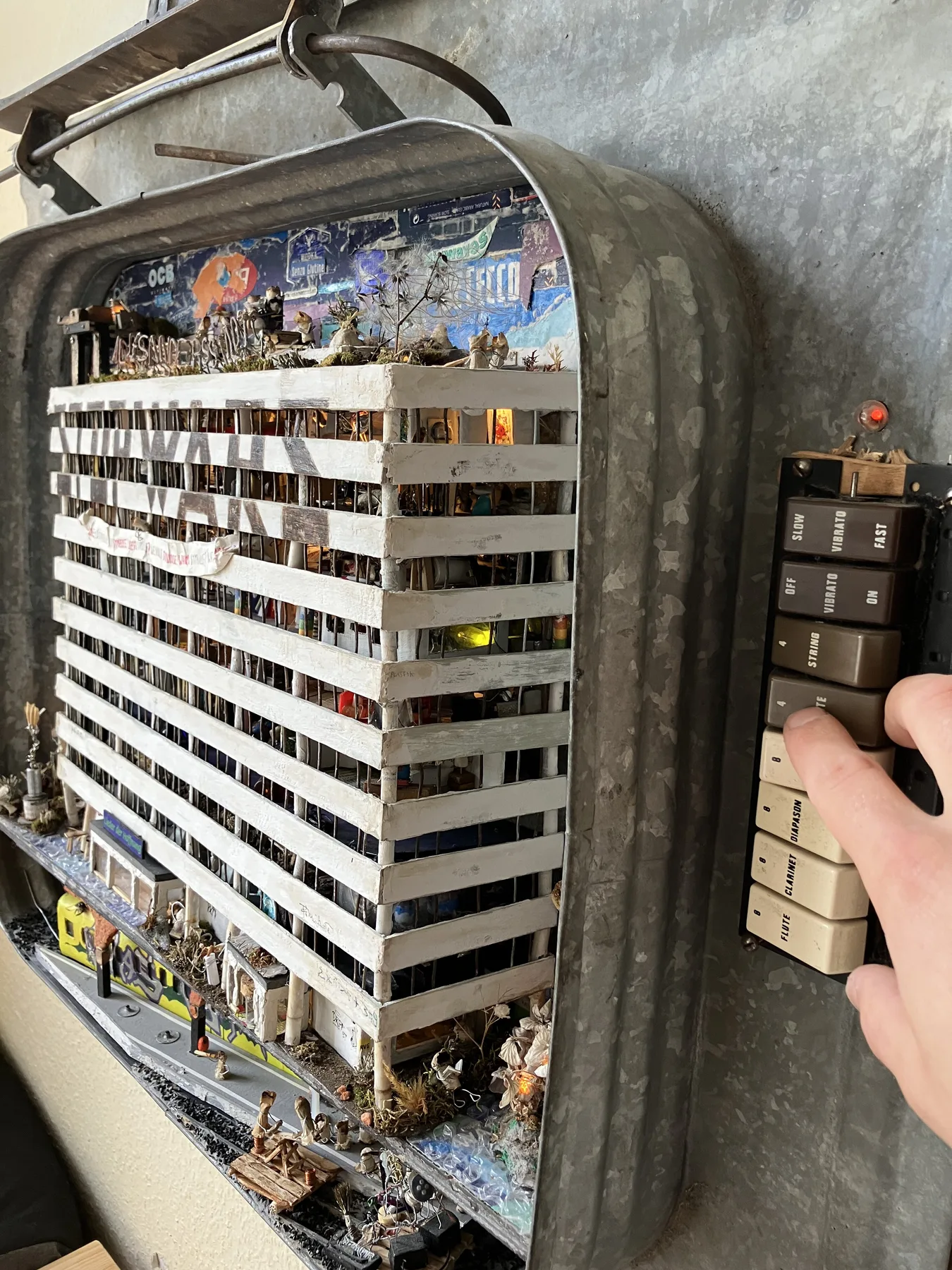 A visitor pressing the electronic switches that light individual floors in STOP WARS