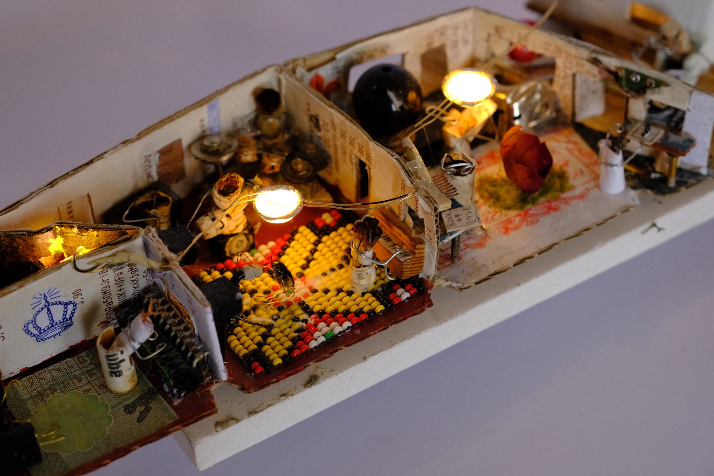 Miniature music studio with instruments, singer, and mixing room