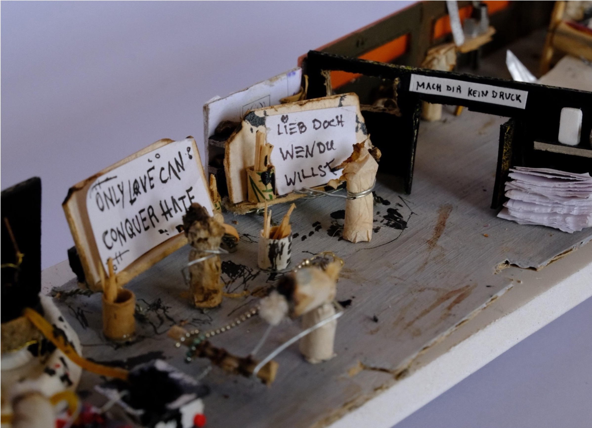 Miniature banner reading only love can conquer hate