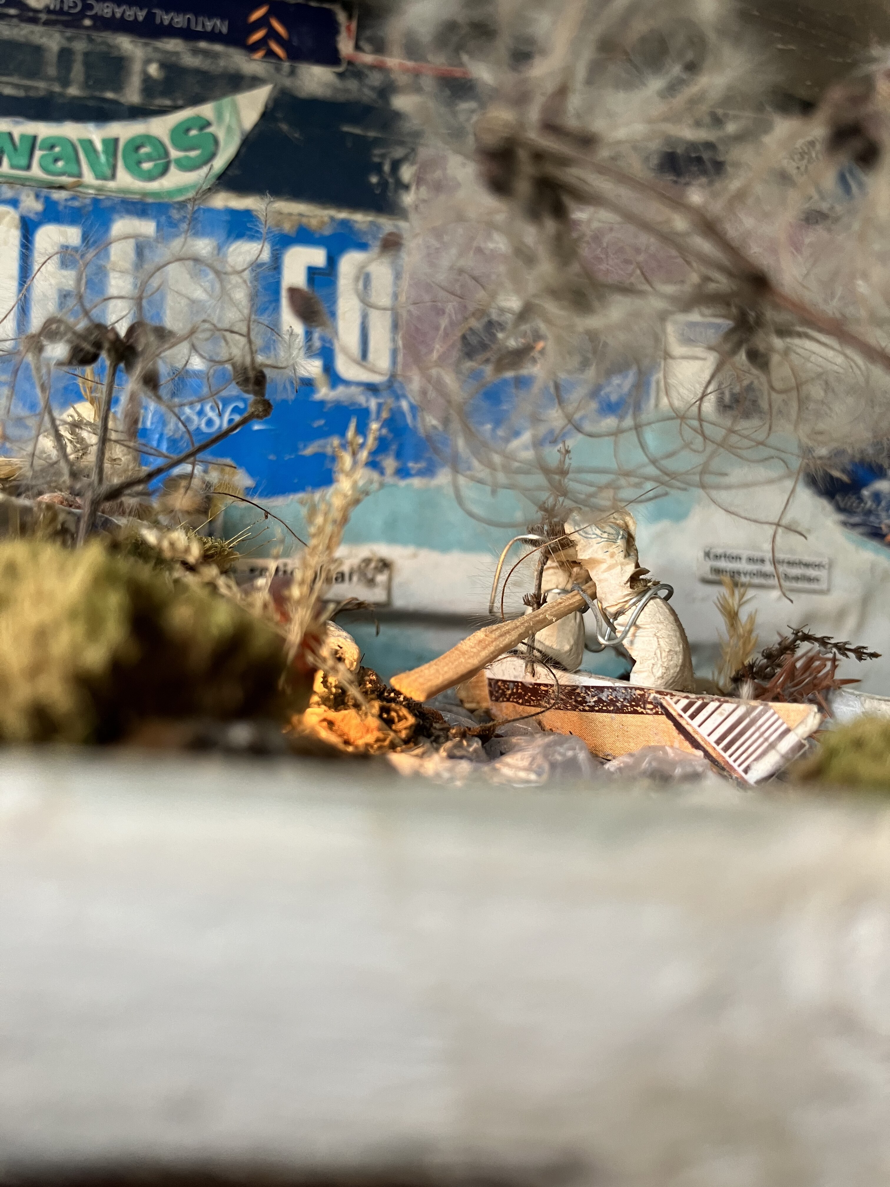 Two cigarette figures paddling a boat on the roof